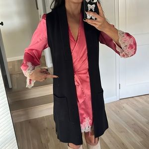 Sleeveless warm knit cardigan.